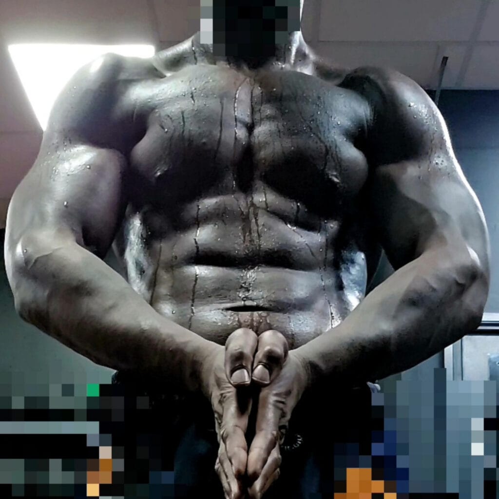 Close-up of a shirtless person with cracked, darkened skin, hands folded in front, face obscured by pixelation in an indoor setting.